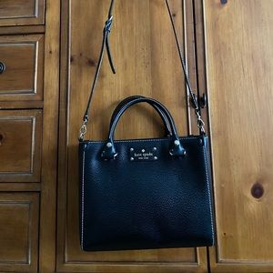 Kate Spade black handbag. Great condition with a vibrant pink lining.